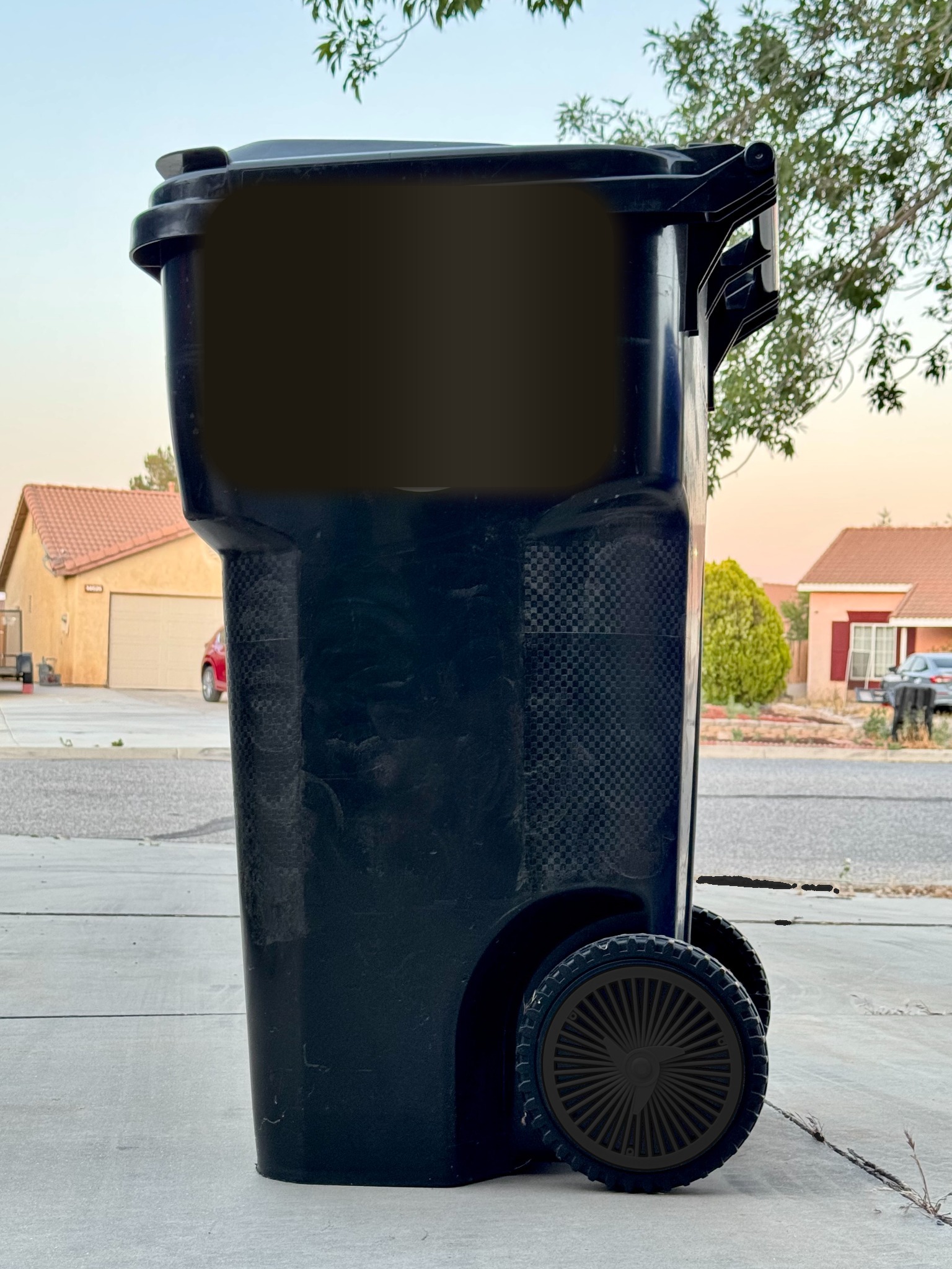 Before trash bin with plain black wheels